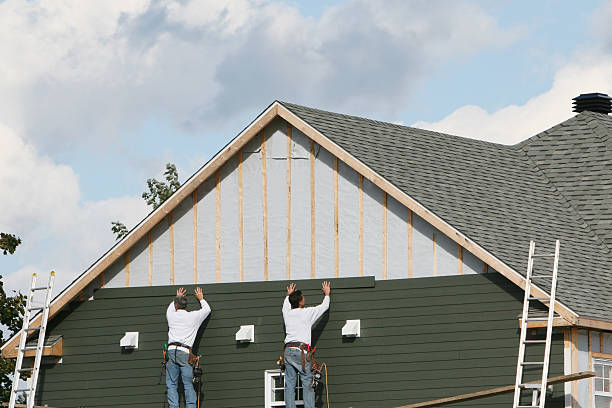 Professional Storm Damage Siding Repair technician working in Smithtown, NY